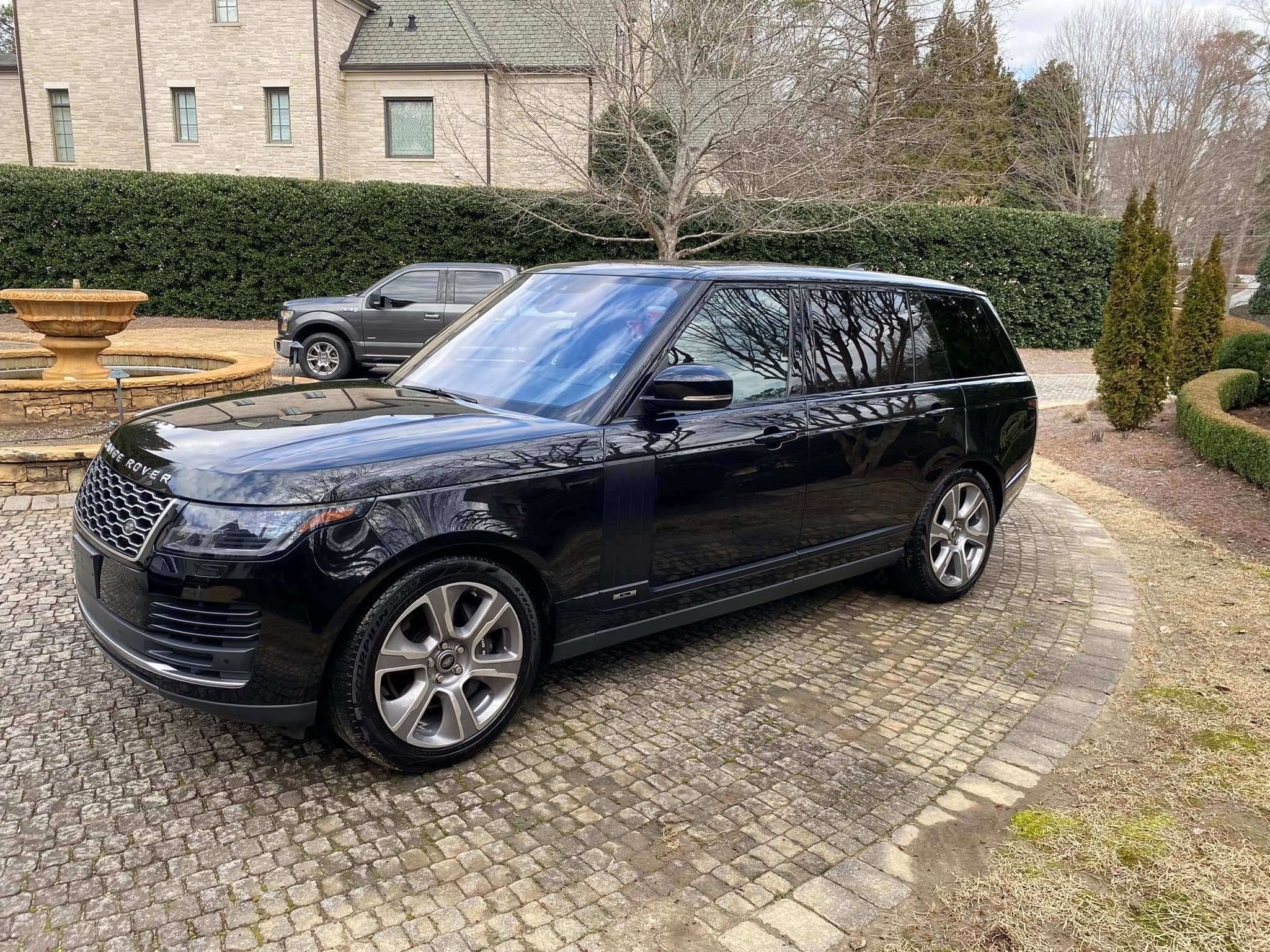 Detailed black Range Rover in Atlanta driveway, Way2Clean Mobile Detailing